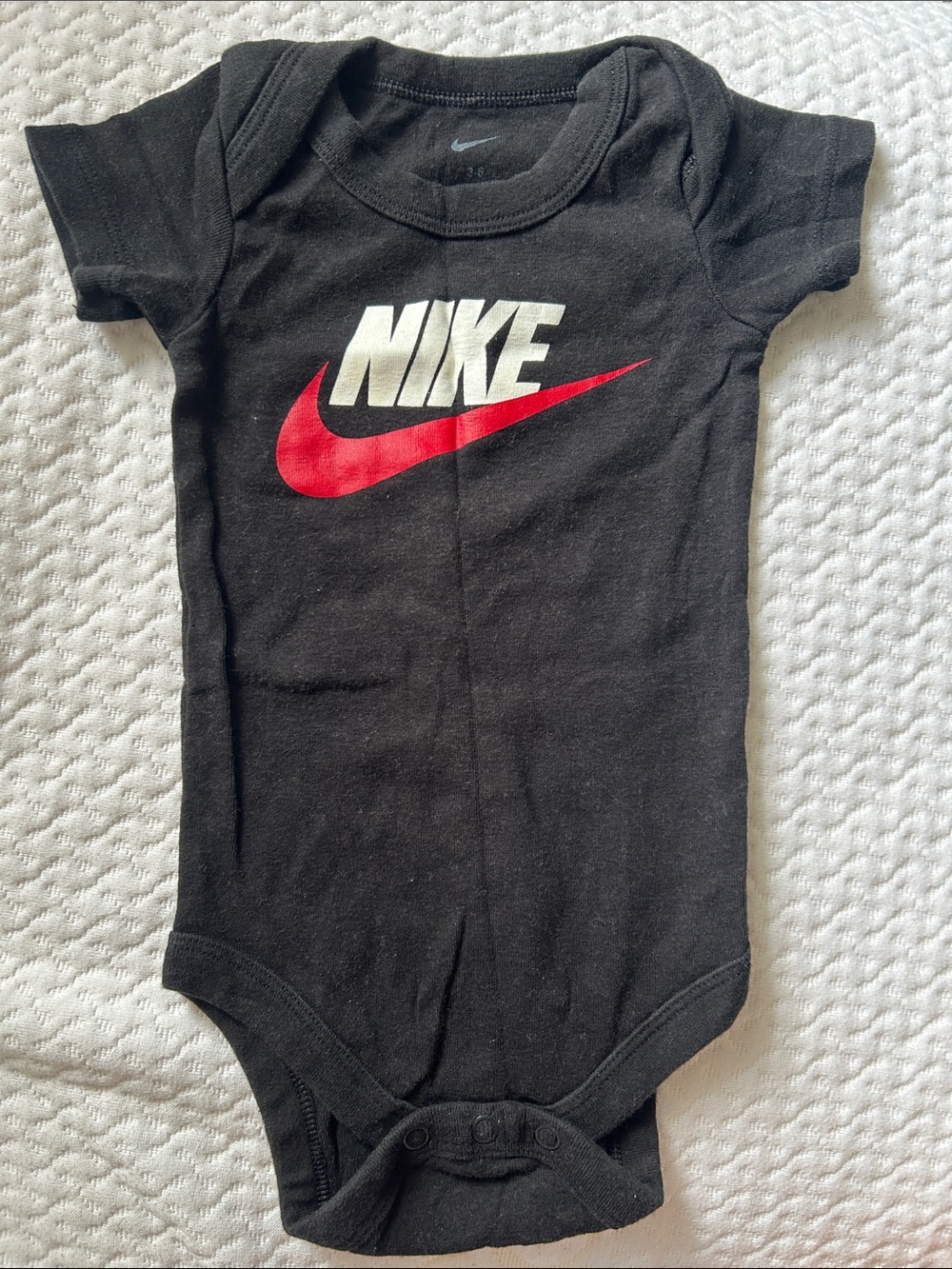 Nike Black Baby One-Piece Bodysuit with Red Swoosh